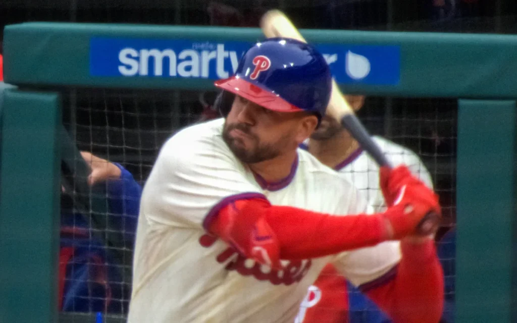 Kyle Schwarber swinging during a Phillies game — one of the best MLB players 2026